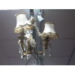 A Mid XX Century Ormolu Three Branch Ceiling Light, the acanthus moulded branches each hung with