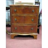 A Mahogany Serpentine Fronted Bedside Chest of Three Drawers, on bracket feet 52.5cm wide.