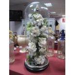 Floral Fabric Display Under Glass Dome, on ebonized stand, approximately 48cm high overall.