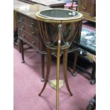 An Edwardian Brass Jardiniere, housed in a mahogany inlaid stand, having three sabre legs united