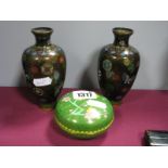 A Pair of Cloisonne Ovoid Vases, decorated with butterflies and symmetrical motifs on a black ground