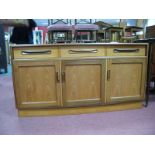 G. Plan, E. Gomme Limited, teak sideboard with protruding fold over handles to three upper drawers
