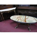 An Italian Oval Onyx Topped Coffee Table, on gilt metal base, a similar hall table with serpentine