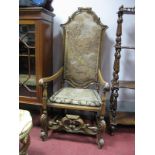 A Late XVII Century Style Mahogany Open Arm Hall Chair, upholstered back and seat, moulded outlines,