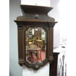 An XIX Century Oak Wall mirror, with a stepped gallery reeded sides, with a octagonal bevelled