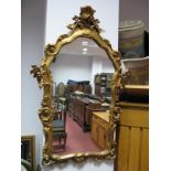 A Gilt Framed Wall Mirror, with scroll decoration 103 x 66cm