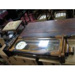 A XIX Century Walnut Vienna Wall Clock, with turned finials to arched top, half round column