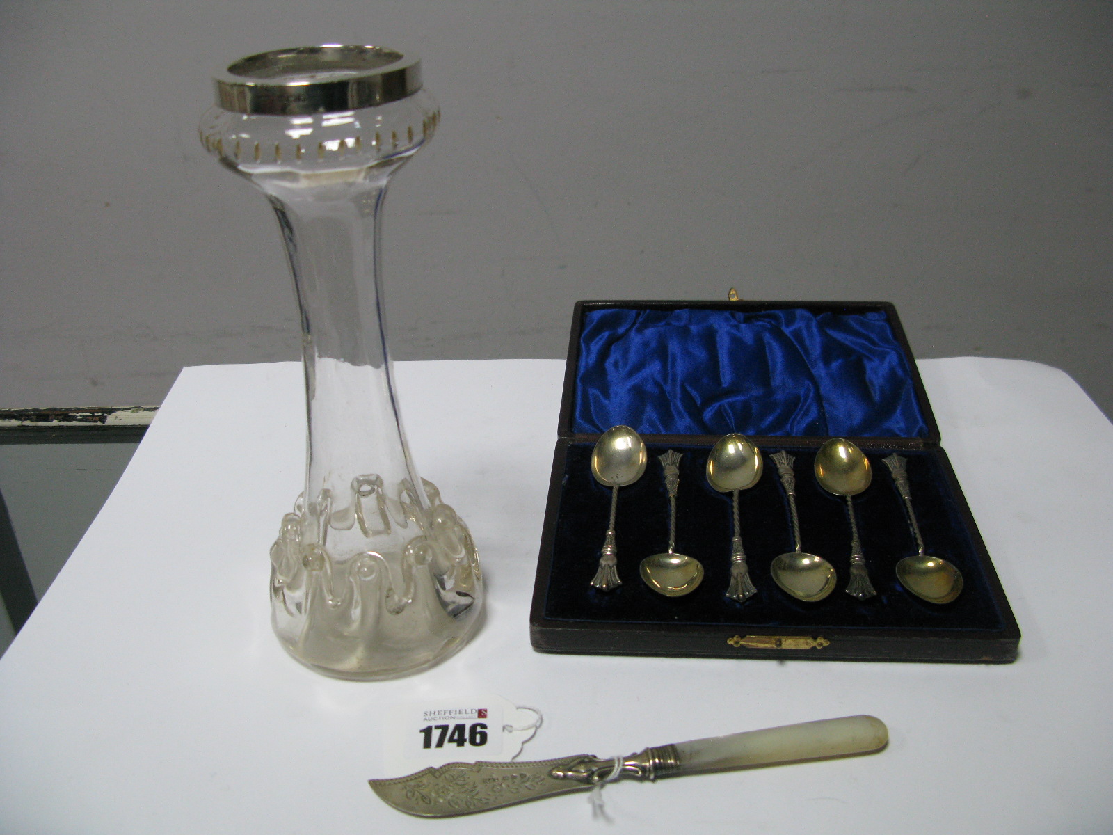 A Cased Set of Six Hallmarked Silver Teaspoons, each with decorative handle, a hallmarked silver and