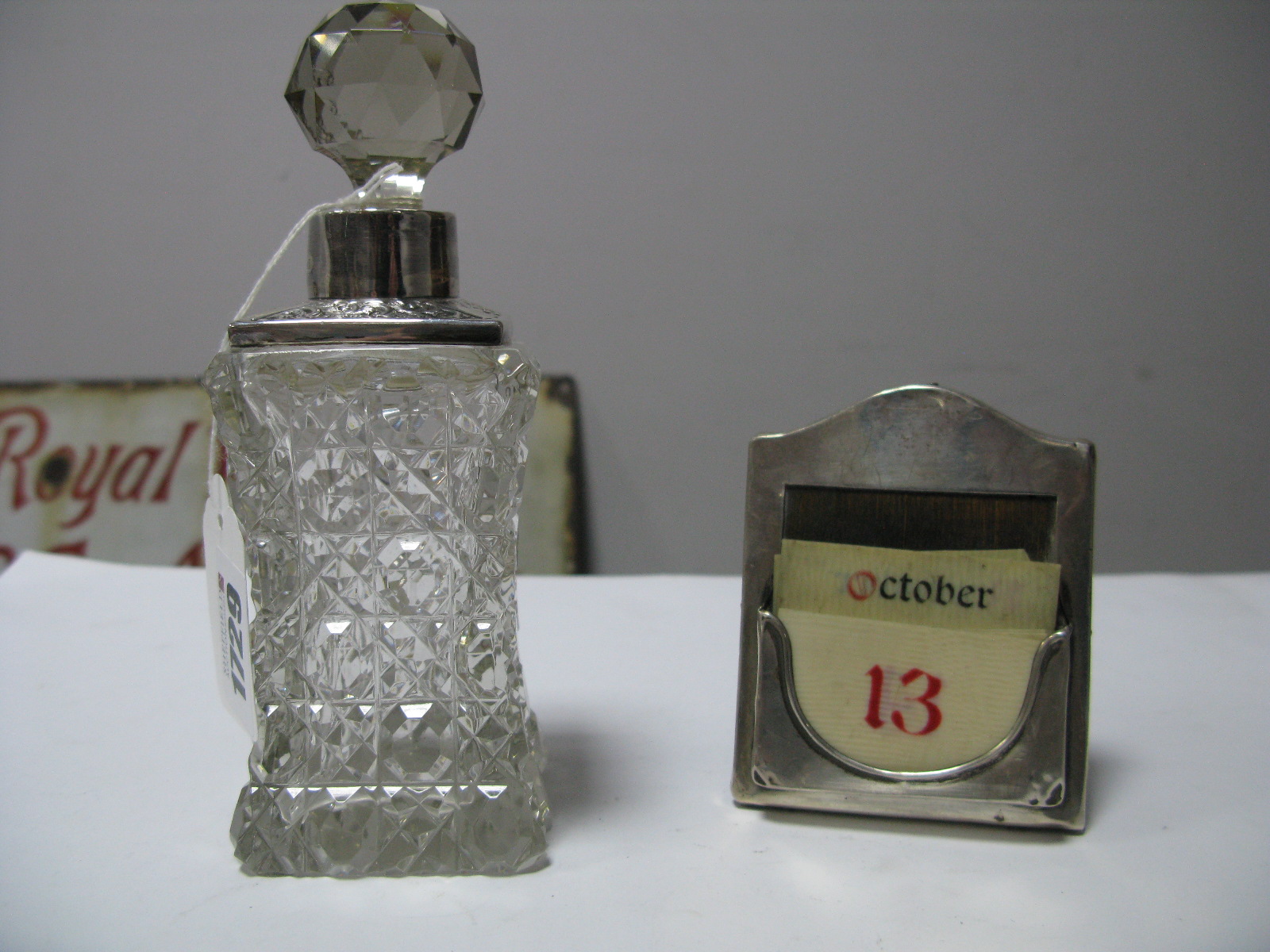 A Hallmarked Silver Mounted Desk Calendar, on wooden easel back; a hallmarked silver mounted glass