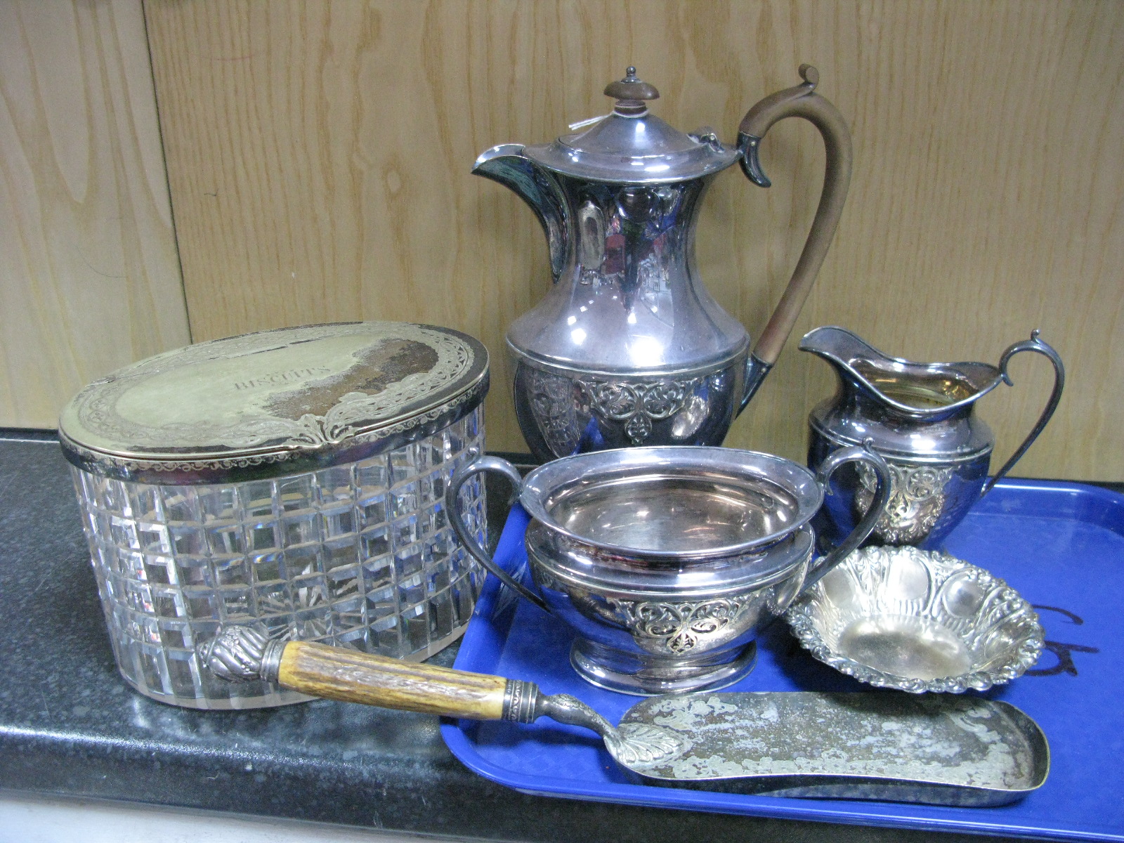 A Plated Mounted Glass "Biscuits" Box, of oval form; plated three piece tea set, decorative dish,