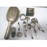 A Hallmarked Silver Backed Hand Mirror, hallmarked silver tea and other spoons, mother of pearl han