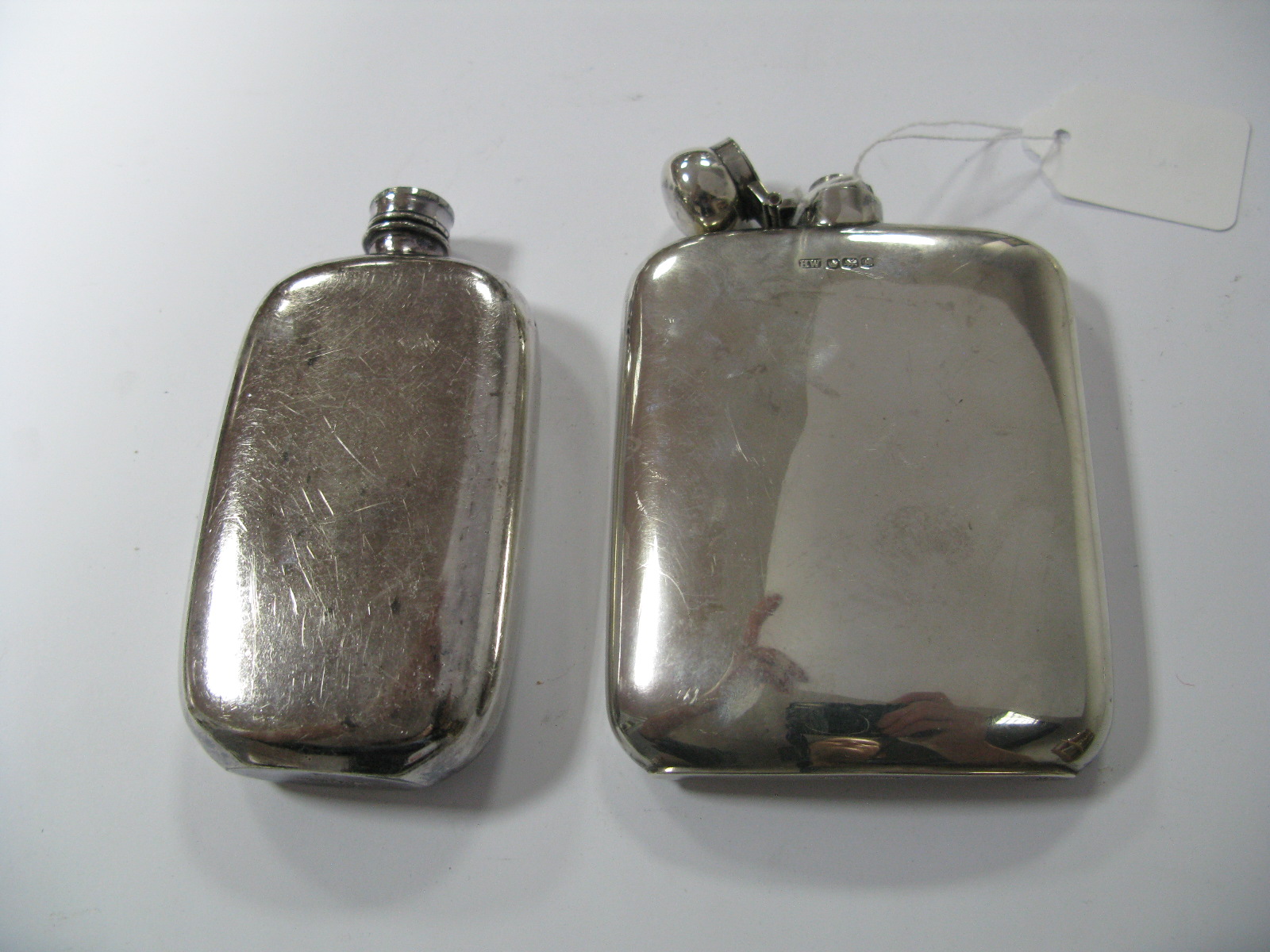 A Hallmarked Silver Hip Flask, HW, Sheffield 1943, of plain rounded rectangular form; together