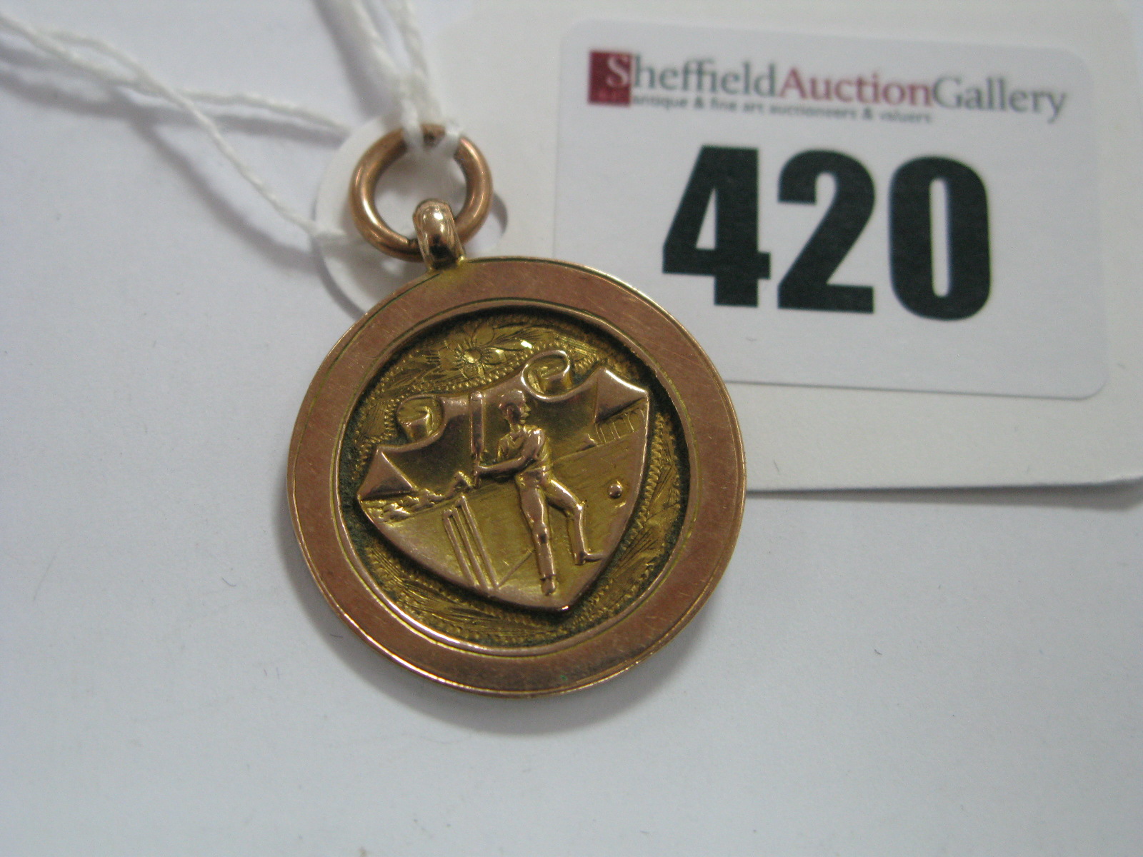 A 9ct Gold Cricketing Medallion.