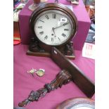 A Mahogany Cased Wall Clock, 8" white enamel dial, Roman numerals, the casing with carved scroll