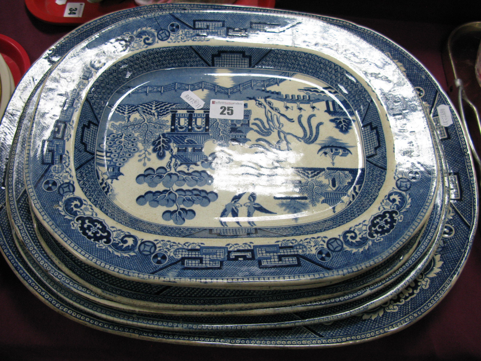 Six Blue and White Willow Pattern Pottery Meat Plates.