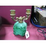 A Malachite Candelabra, the base of square section with foliate carved decoration, and cast brass