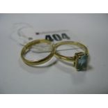 An 18ct Gold Plain wedding Band Ring, an 18ct gold four claw set dress ring. (2)