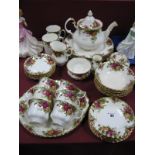 A Royal Albert Old Country Rose Teapot, first quality, and second quality dinner ware of thirty