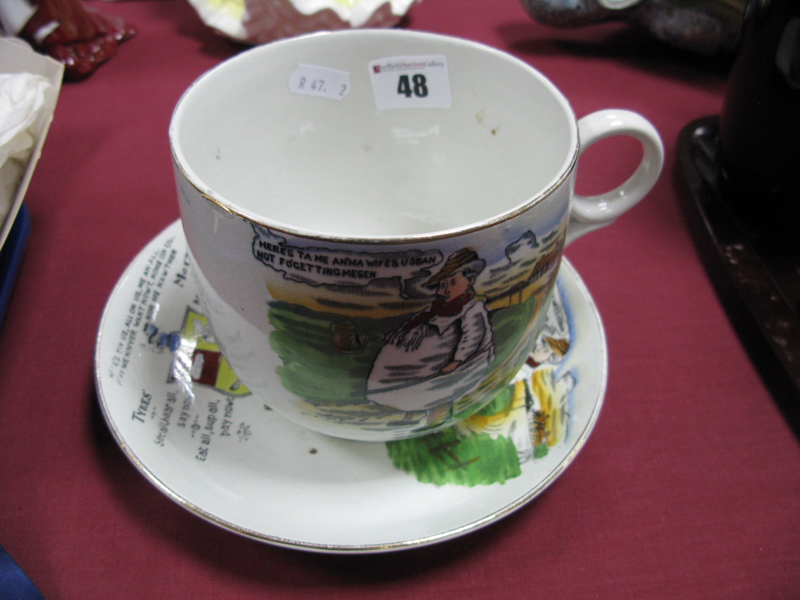 A Large Early 1900's Tykes Motto Teacup and Saucer, stamped 'Trade Mark Tyke B&K Ltd' to bases.