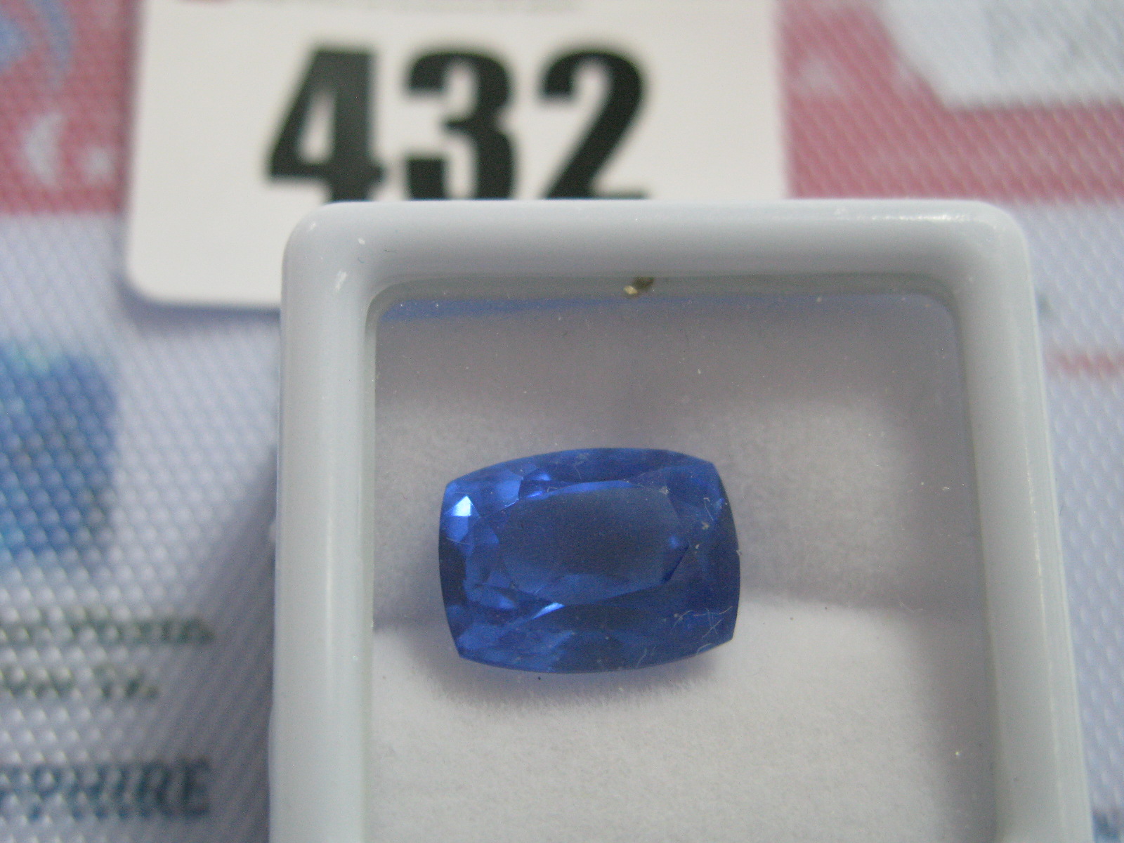 A Cushion Cut Sapphire, unmounted, with a Global Gems Lab Certificate card, stating carat weight 7.