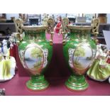 A Pair of Noritake China Urns, each with gilt highlights and handles, oval hand painted river