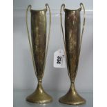 A Pair of Hallmarked Silver Vases,each of tall slender tapering form, with high loop handles, on