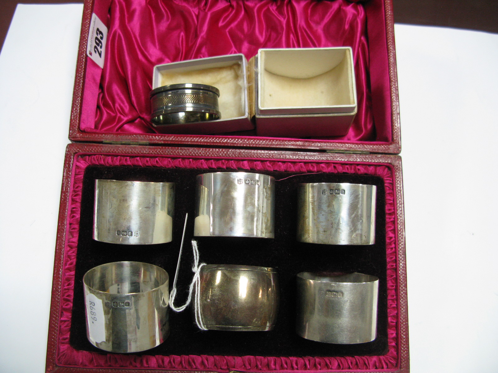 A Matched Set of Five Hallmarked Silver Napkin Rings, together with another, each of plain design,