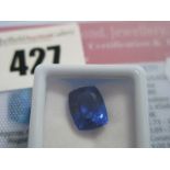 A Cushion Cut Sapphire, unmounted, with a Global Gems Lab Certificate card stating carat weight 7.80