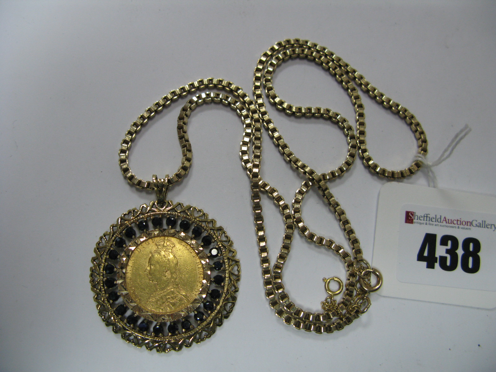 A Victoria Sovereign 1891, loose (?) set within a highly decorative 9ct gold openwork mount, with