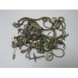 A Double Curb Link Bracelet, stamped "Sterling" to fastener, suspending novelty charms, including