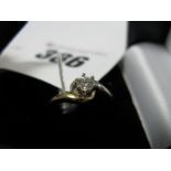 A Modern 18ct Gold Single Stone Diamond Ring, the brilliant cut stone, claw set, between two tone
