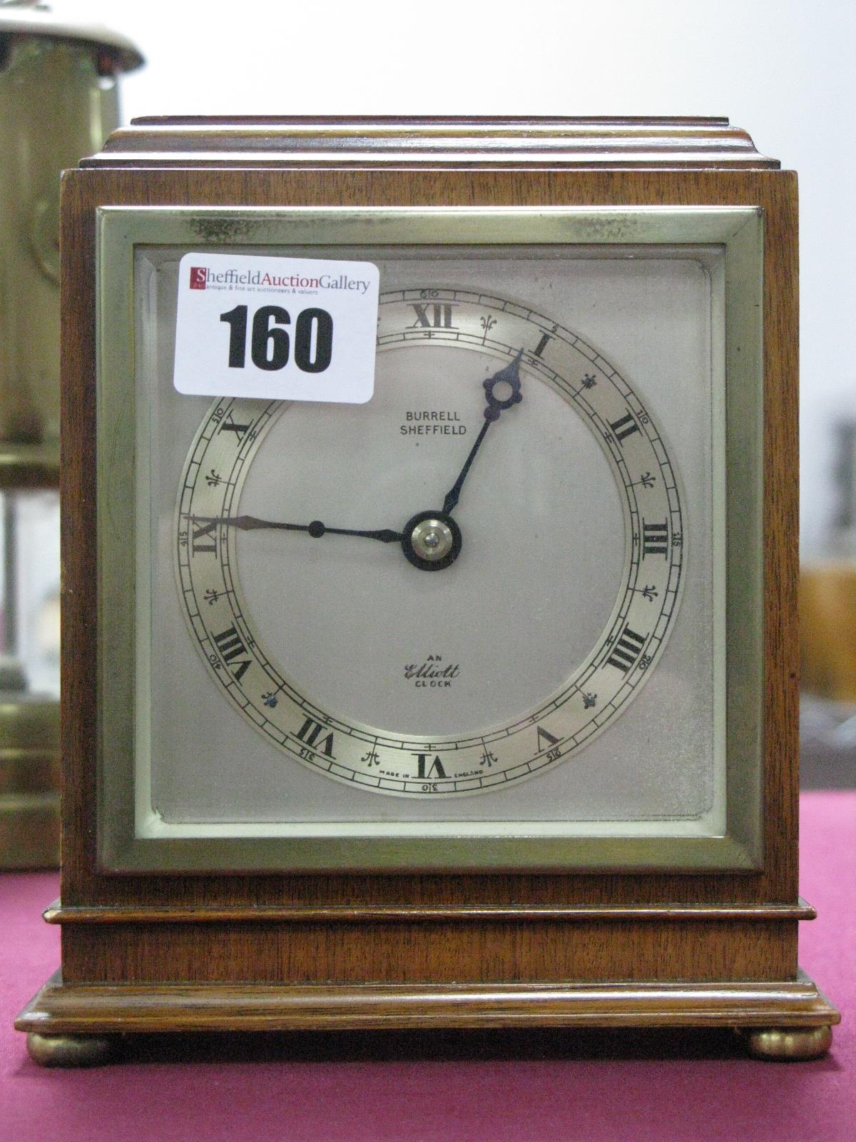 An Elliott Mahogany Cased Mantel Clock, labelled 'Burrell Sheffield', on brass squat bun feet.