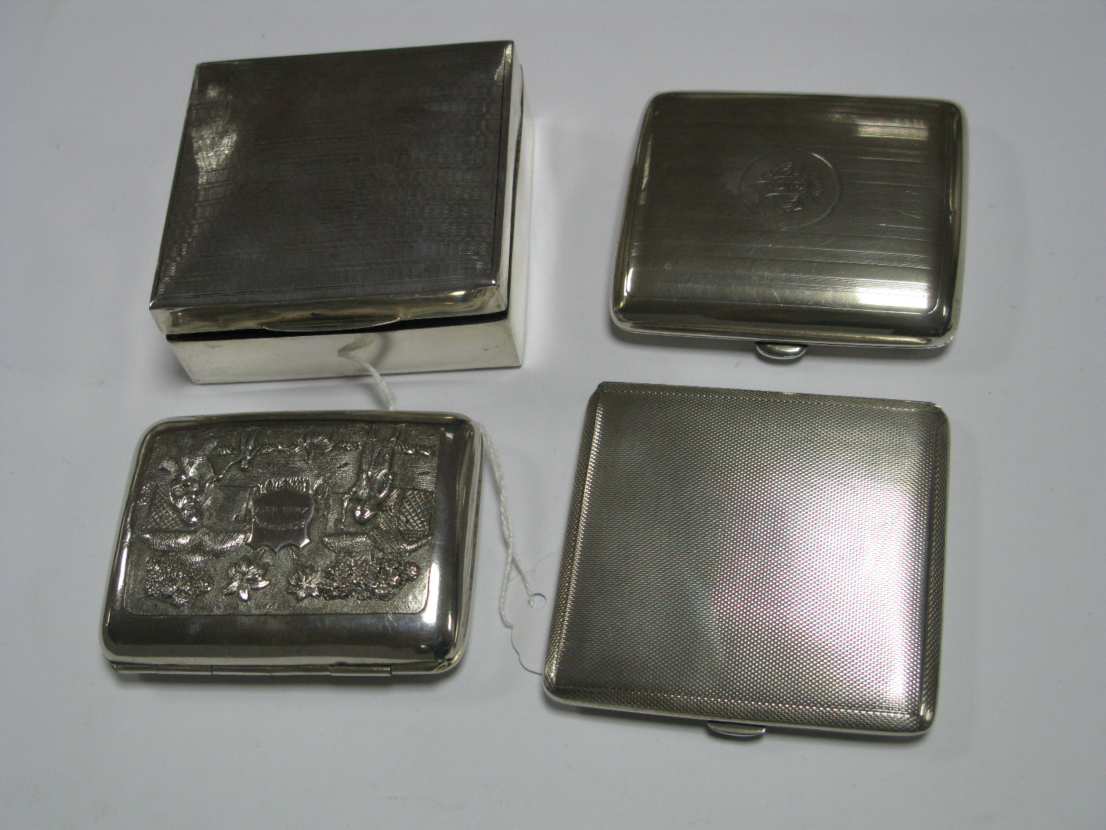 A Square Hallmarked Silver Cigarette Box, with engine turned lid; allover decorated Indian style