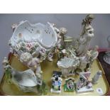 A XIX Century Fairings, Meissen Style Bowl, supported by three cupids with cross swords on base of