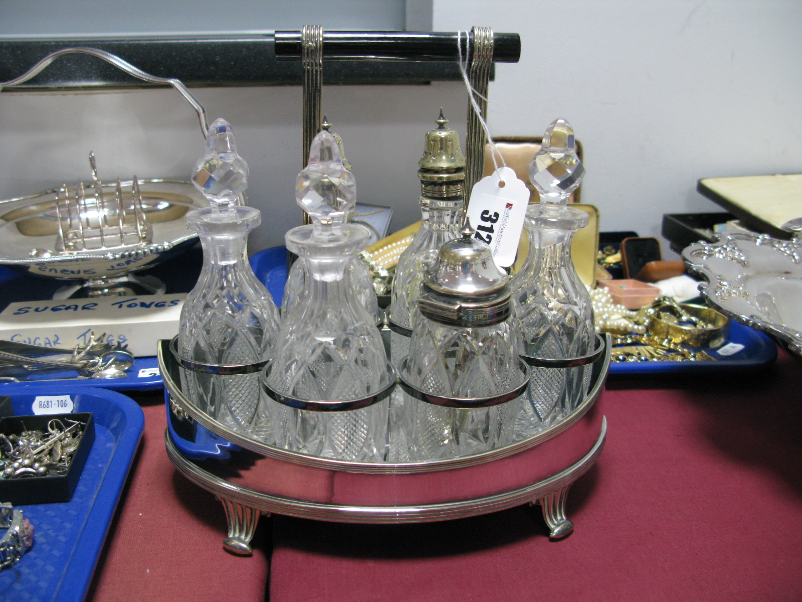 A Deykin & Sons Plated Condiment Stand, fitted with six matching bottles/jars, the stand of plain