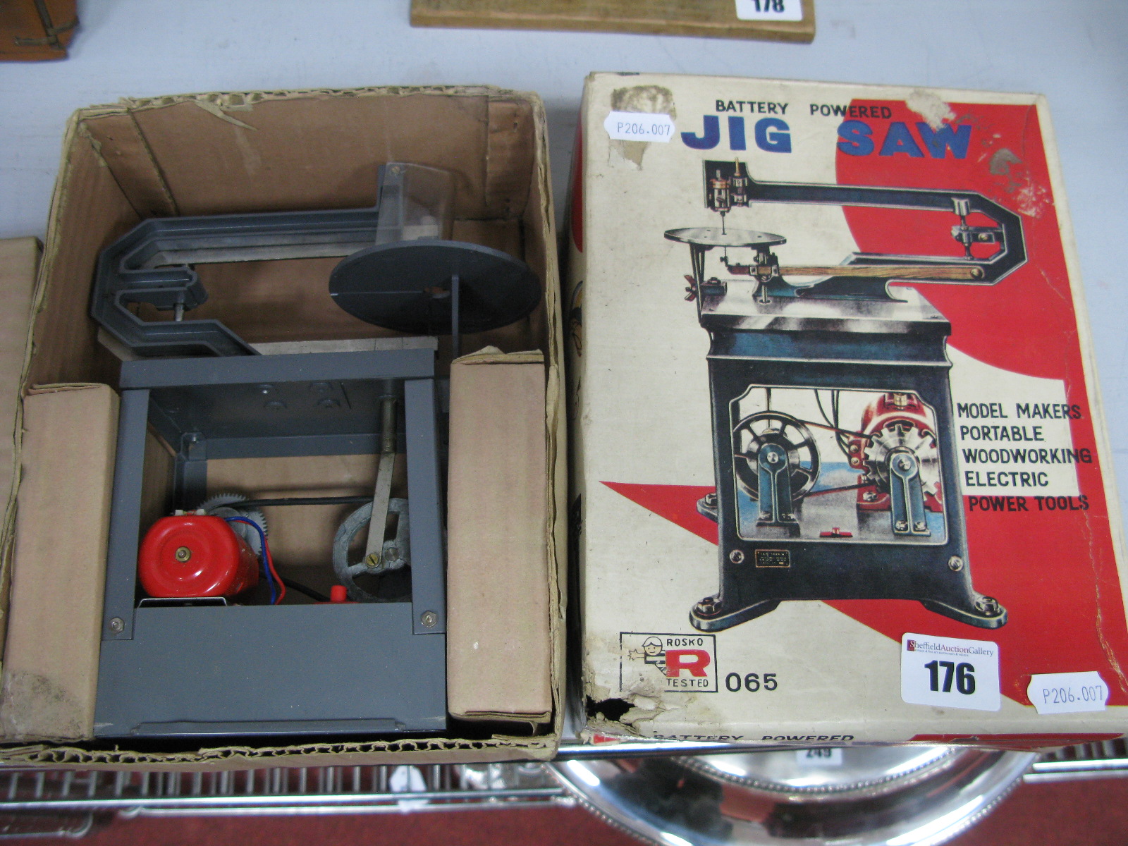 A Toy Battery Powered Model of a Jig Saw by Rosko of Japan, boxed.