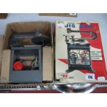 A Toy Battery Powered Model of a Jig Saw by Rosko of Japan, boxed.