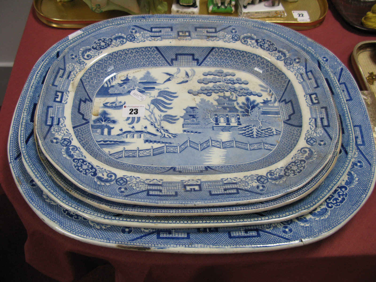 Four Blue and White Willow Pattern Pottery Meat Plates.