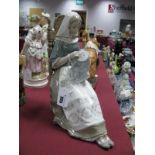 Lladro Figure 'Embroidery Lady', a seated lady with tapestry.