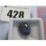 An Oval Cut Sapphire, unmounted, with a Global Gems Lab Certificate card stating carat weight 8.