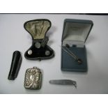 A Vesta Case, of textured foliate design, two decorative stick pins, two pocket knives, gent's shirt
