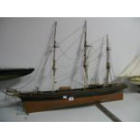 A Wooden Model of a Clipper Ship, holding four lifeboats, 92cm wide.