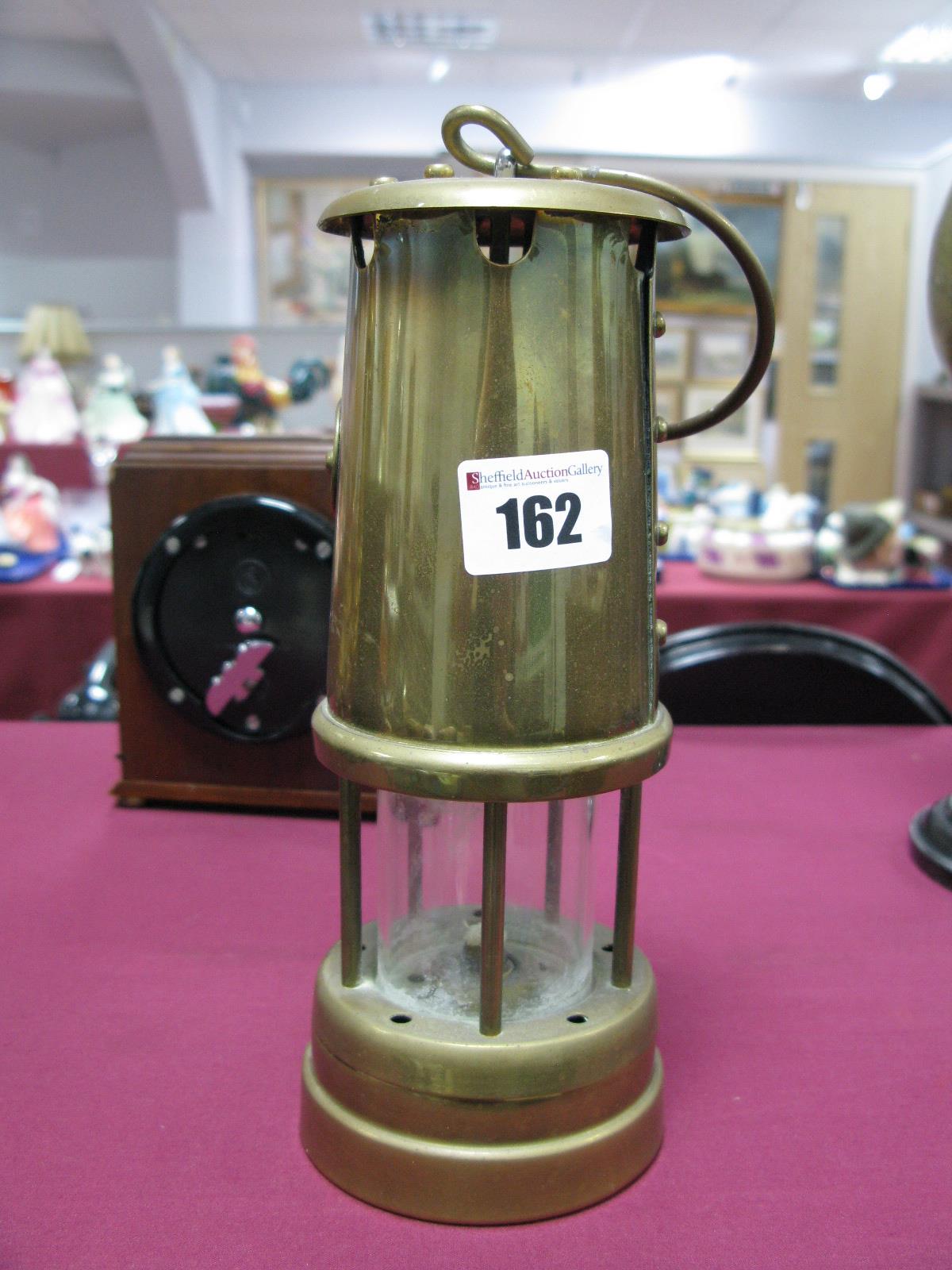 Brass Miners Lamp, with oval Cymru Dragon plaque.