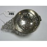 A Hallmarked Silver Strainer, (marks pierced/incomplete) London 1927, modelled as an earlier fruit