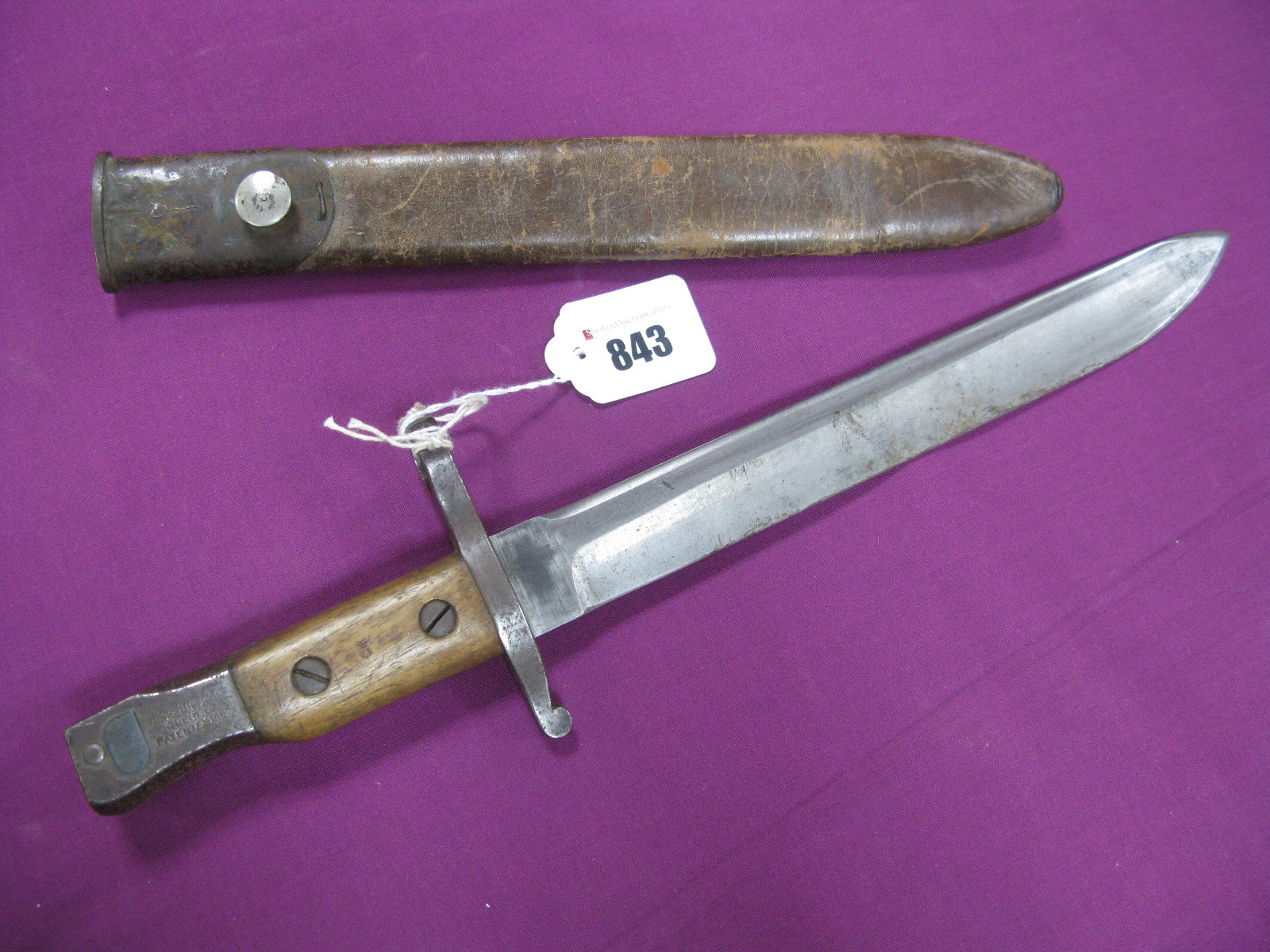 A WWI Canadian Ross Bayonet, 25.5cm blade to wooden grip stamped - '2B' for 2nd Battalion, spring