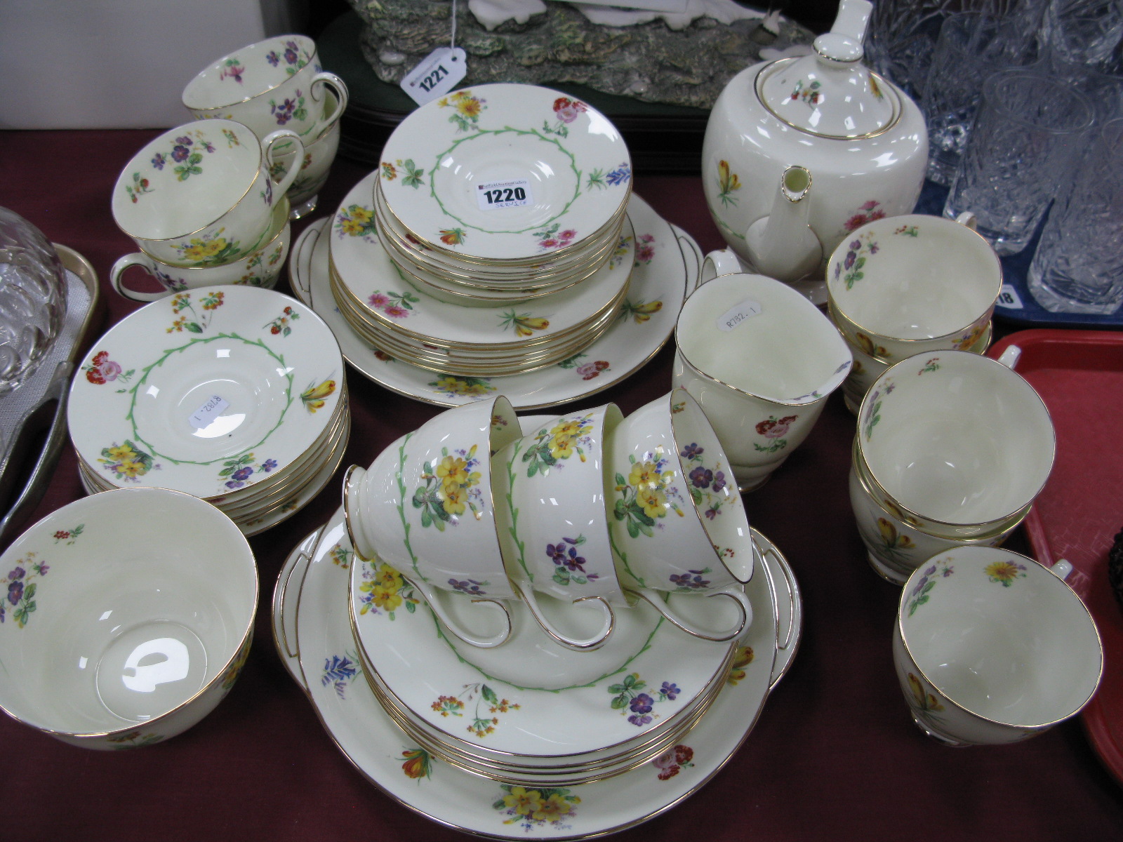 A 1930's Royal Doulton Tea Service, pattern No. V1566, shape Sylvia, decorated with a design of