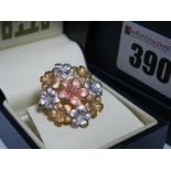 A 9ct Gold Three Colour Floral Brooch, of flowerhead design, in a box.