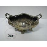 A Hallmarked Silver Twin Handled Oval Planter/Dish, of shaped oval form with scroll handles, on