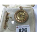 A Decorative Ladies Fob Watch, the dial with black Roman numerals (lacking perspex/glass), with