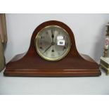 A XX Century Mahogany 'Napoleon' Musical Mantel Clock, with a silvered dial, on bun feet.